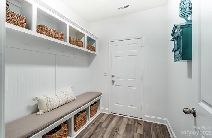 Custom mudroom off garage entry with custom sunbrella cushion for bench