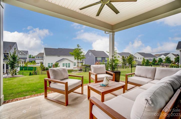 Back covered porch with upgraded lighting and fan
