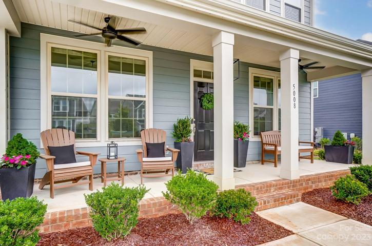 Cozy front porch with upgraded lighting and fans