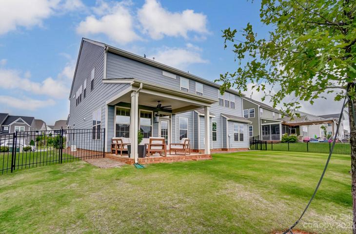 View of home and spacious backyard