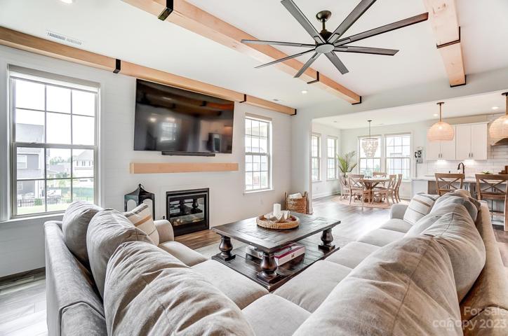 Large open family room with upgraded ceiling fan