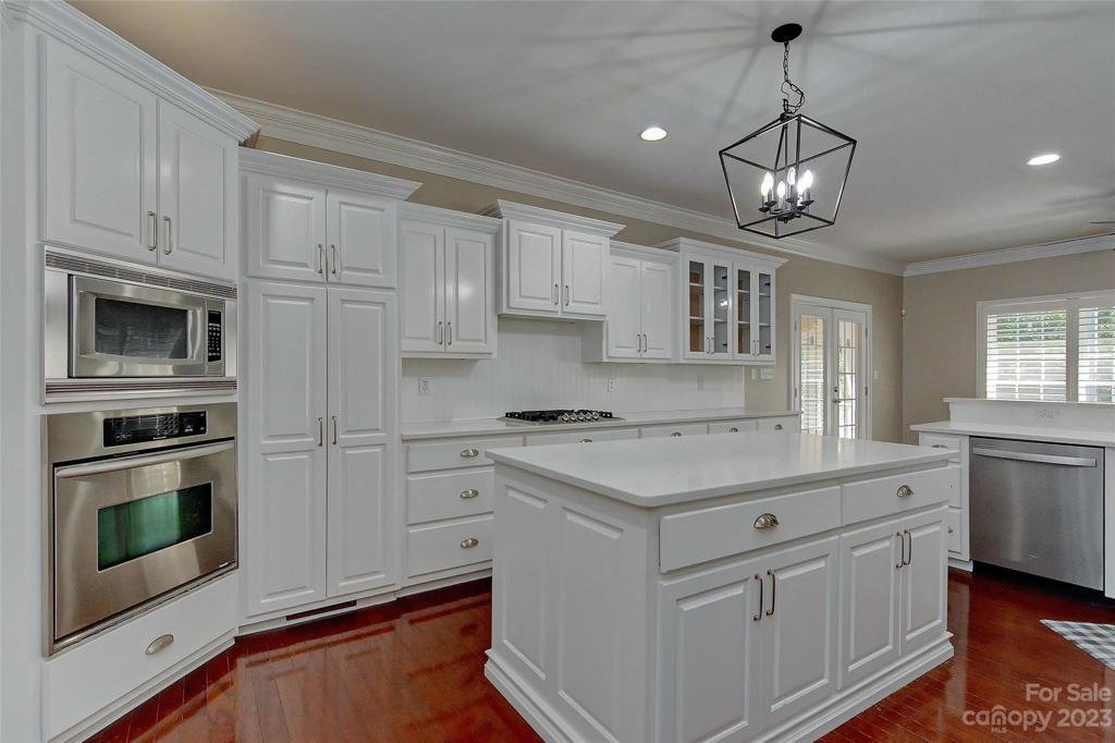 Kitchen also features above & below cabinet lighting, some recessed lighting, crown molding