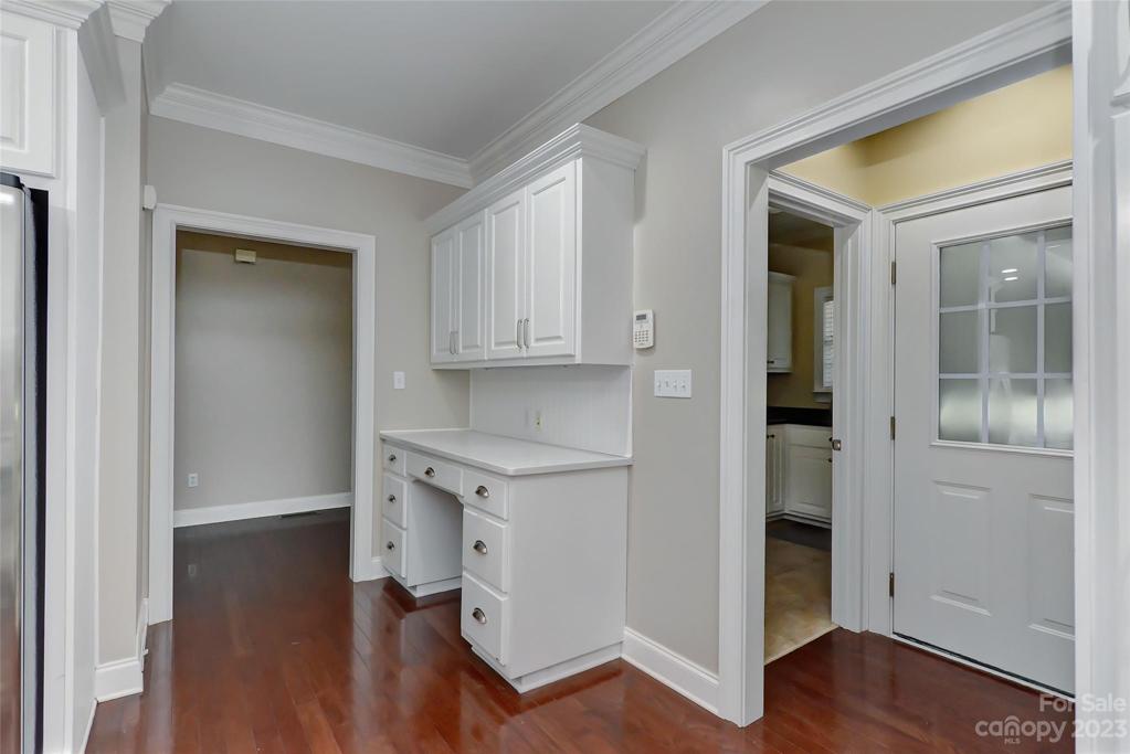 Work station off to the side of kitchen.