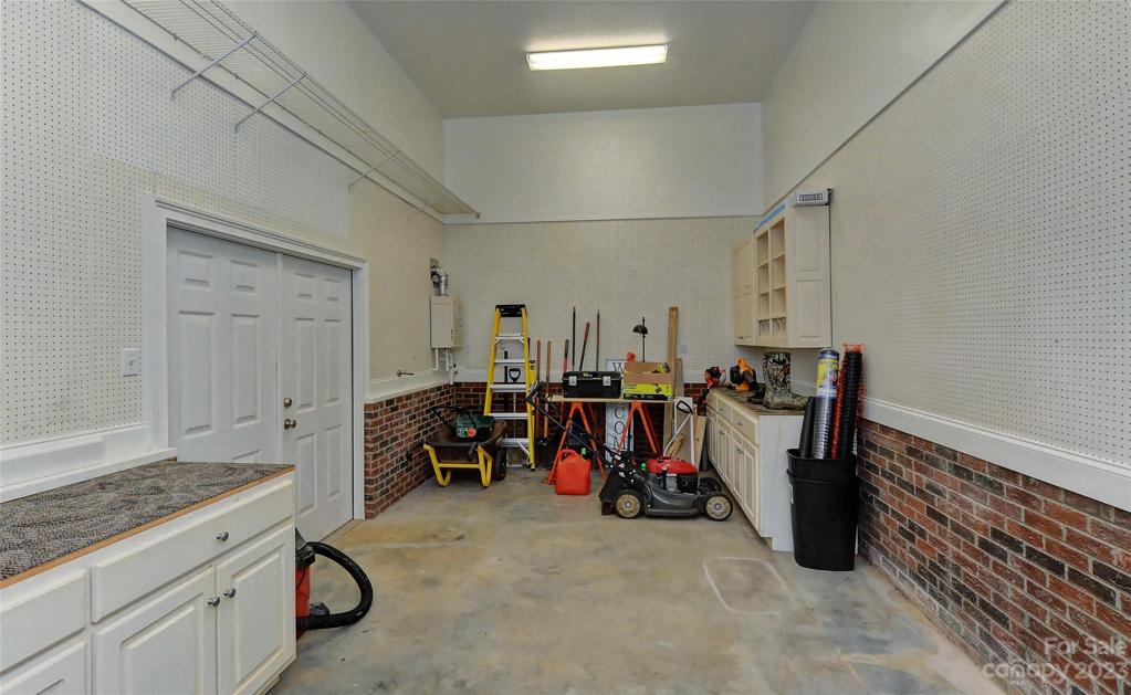 Are you handy?  This is a great work shop or just added storage area. 2 access entries, where the tankless water heater is located.