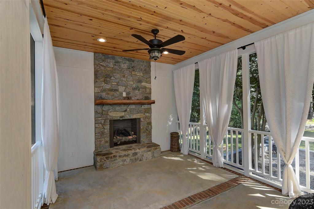 Absolutely wonderful screened in porch w/stone fireplace, mantle & gas logs, wood celling, two ceiling fans w/lights,