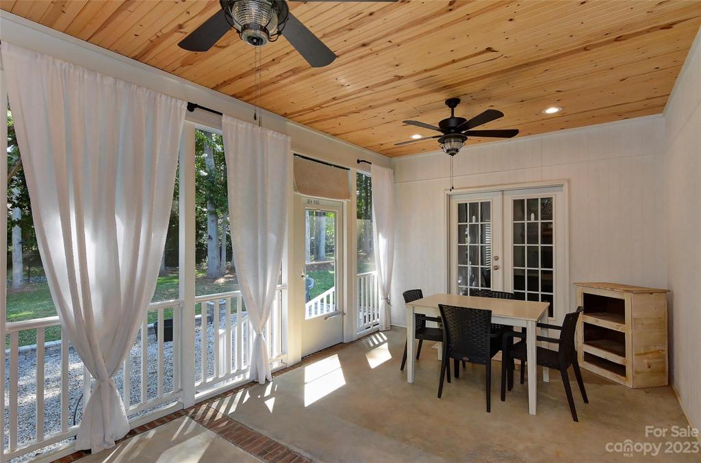 Another view showing the french doors back into and side back door leading to gravel patio & back yard.