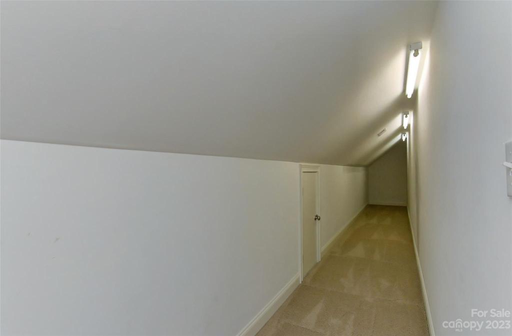 Extra storage space off great room upstairs and also attic access doors.