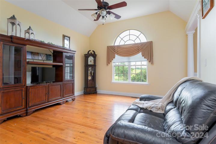 Sitting room that leads to beautiful wrap around porch.