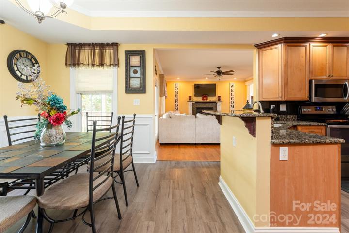 Custom kitchen leading to cozy family room.