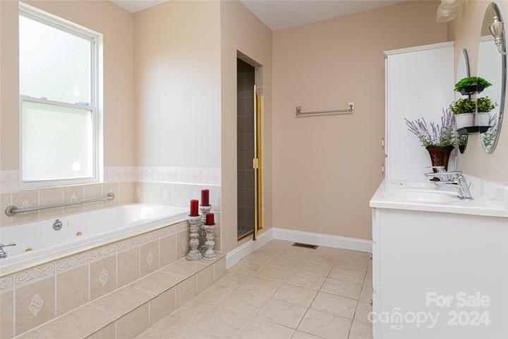 En Suite with garden jetted tub, and walk in shower.