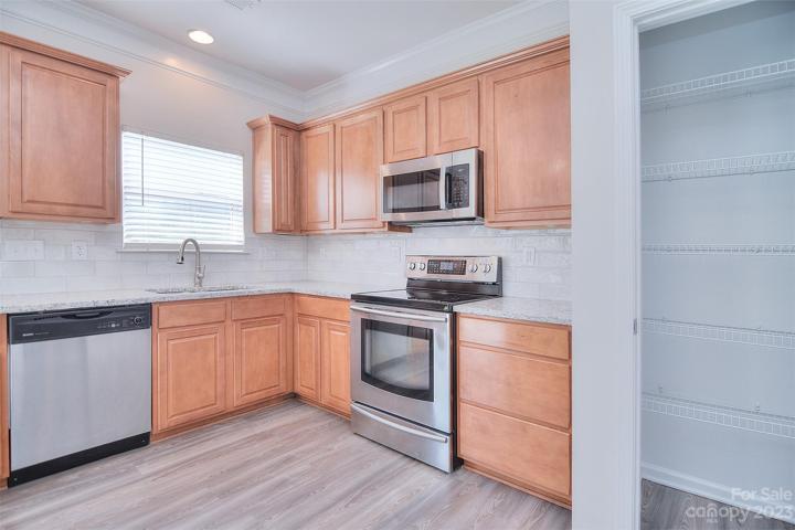 Look out over the backyard while washing dishes or use the dishwasher and enjoy being in the backyard.