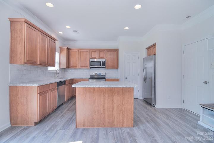 The kitchen is thoughtfully designed, with an island adding to it's versatility.