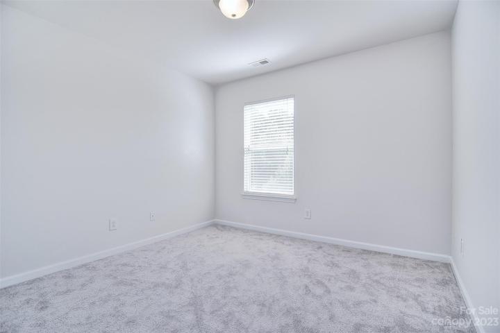 The second bedroom is awaiting your special touch.