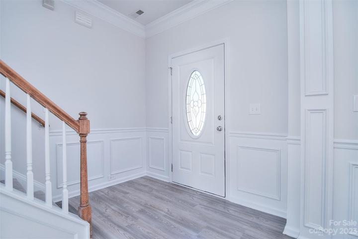 As you step inside, you'll immediately notice the seamless flow of the luxury vinyl plank floor, creating a cohesive and trendy aesthetic that complements the overall interior design.