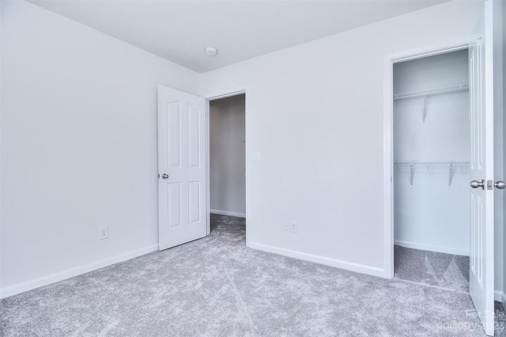 A walk-in closet offers generous storage space.