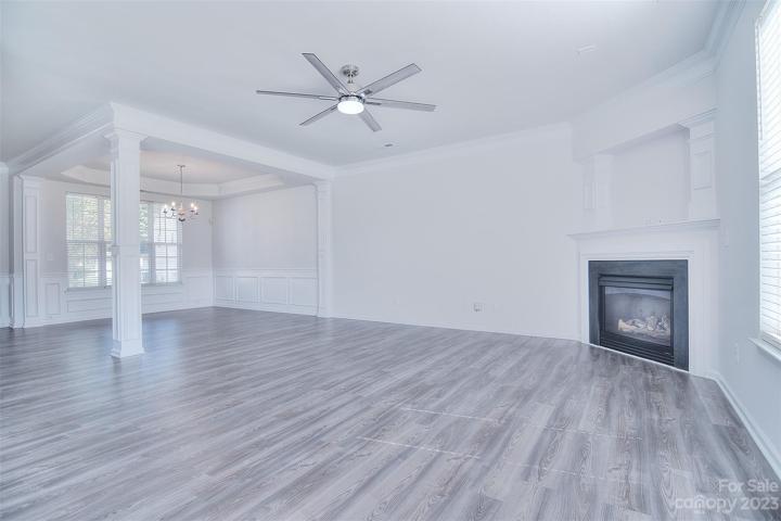 The great room features a fireplace, creating a focal point that adds a touch of coziness.