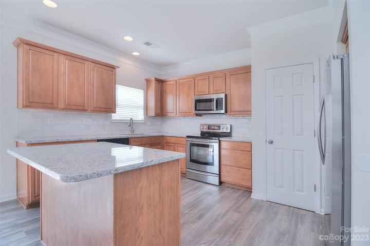 Stainless steel appliances compliment this beautifulkitchen.