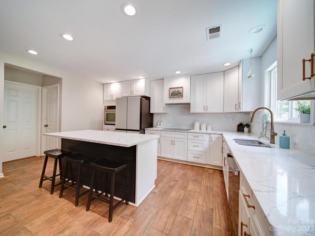 Updated cabinets with quartz counters for ease of maintenance