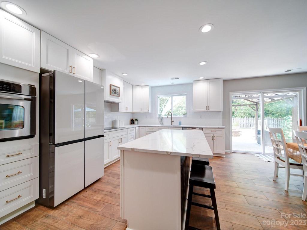 Spacious kitchen includes a new induction cooktop and custom hood vent!