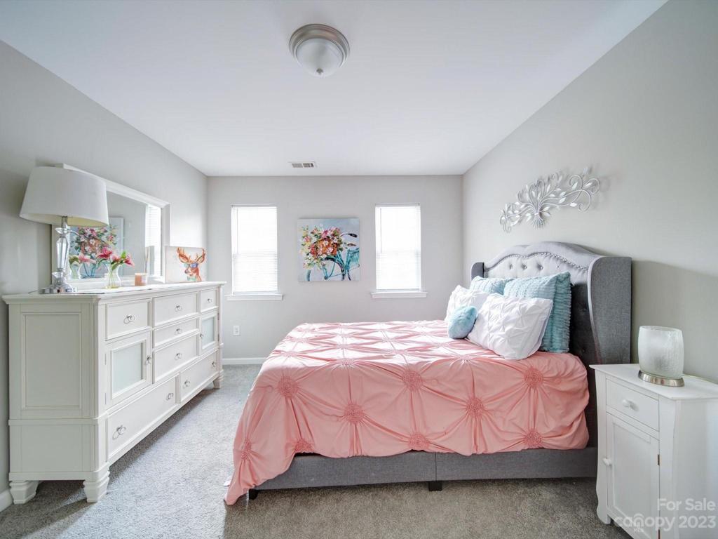 Lots of natural light in this corner bedroom.