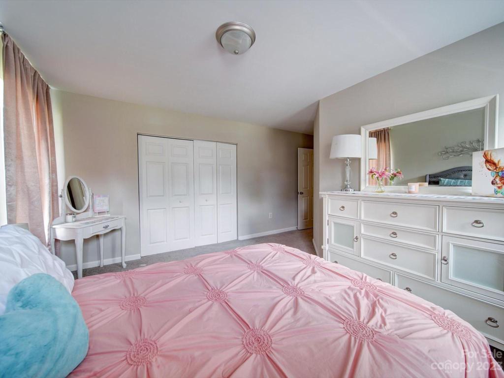 View of secondary bedroom with oversized closet!