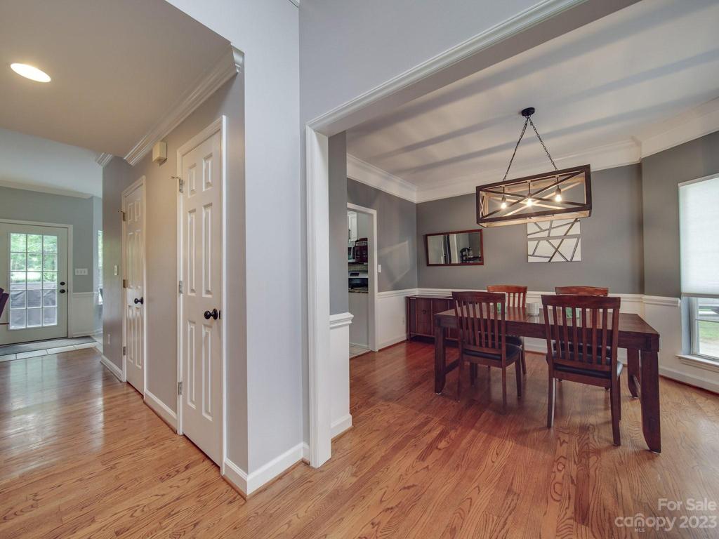 View from front door of Dining Room and hallway to the Living Room