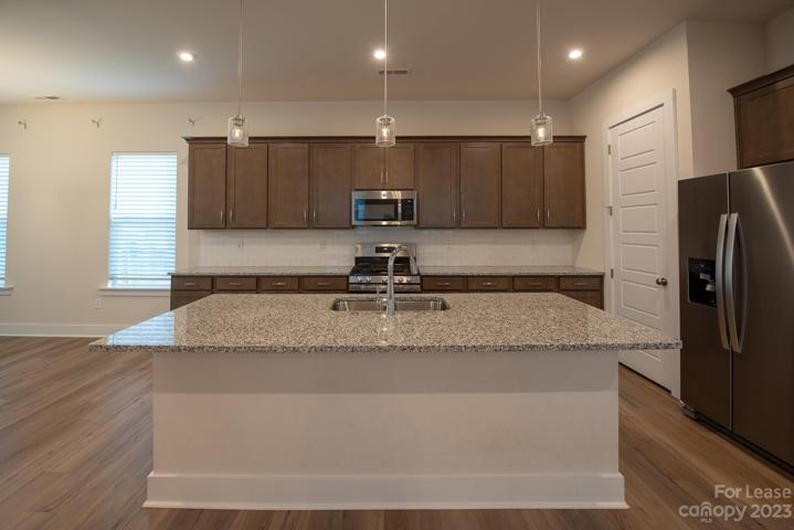 Granite countertops and Gas Stove.