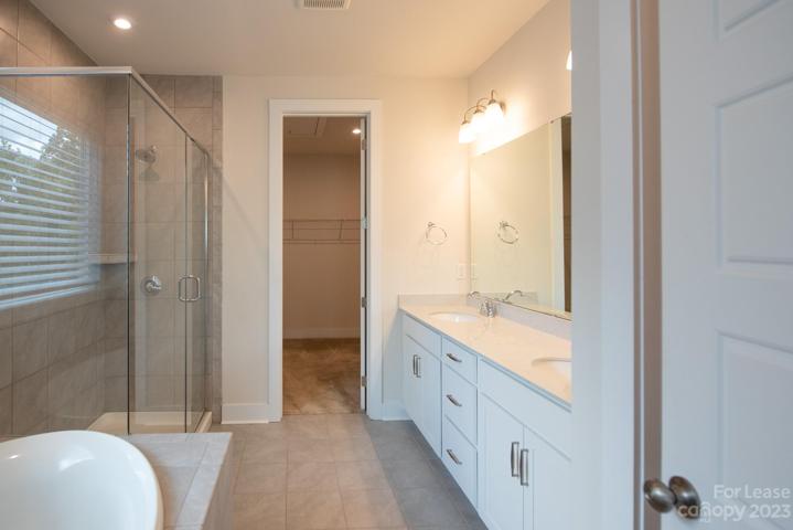 Soaking tub and tile shower, double sinks!