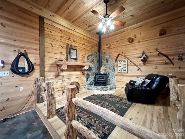 Cozy sitting area in the den with a stand alone wood burning stove.