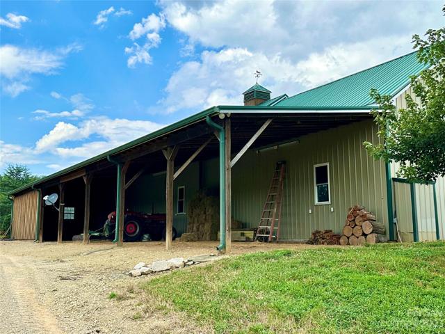 Covered storage area with approximately 1458 sq ft.  Currently used for storing the tractor, hay and farm supplies.