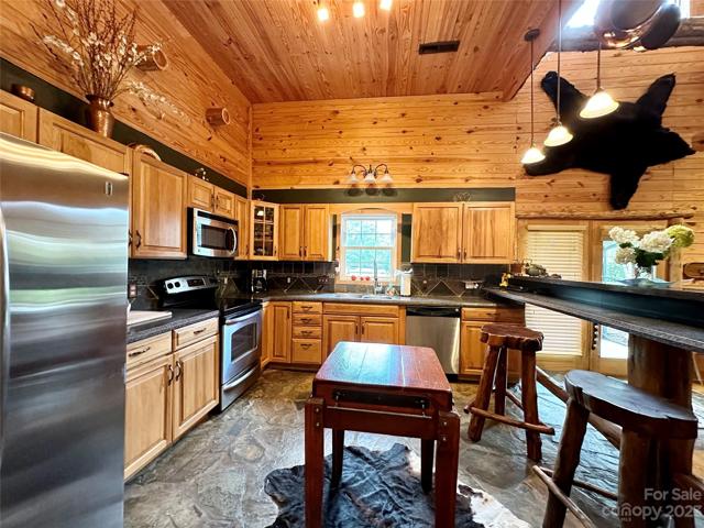 Large kitchen with bar opening up to living room. Perfect for entertaining.