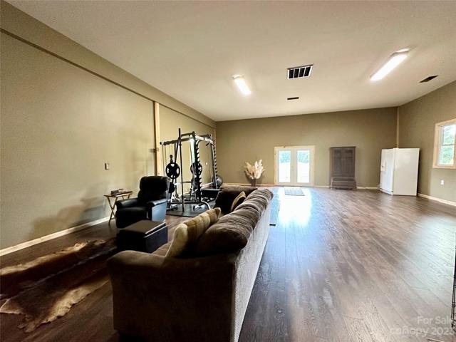 This third bedroom has so many possibilities.. Could be turned in two bedrooms, or another larger primary bedroom and bath.  12' Ceilings..