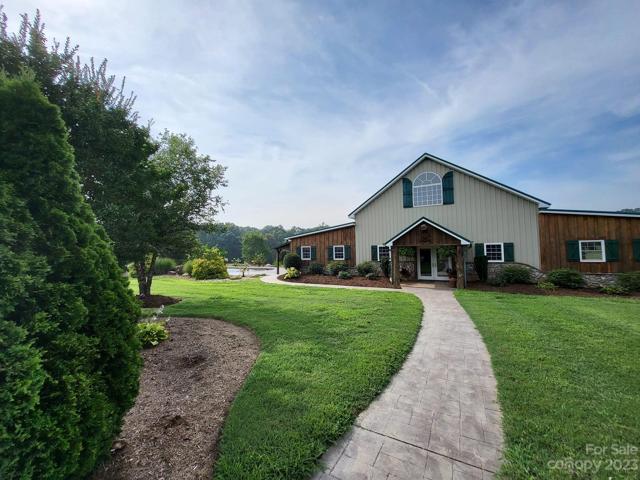 Beautifully landscaped yard leading to the unground pool.