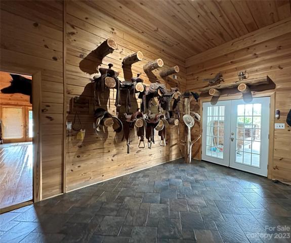 Den with this wall feature for storing your saddles.
