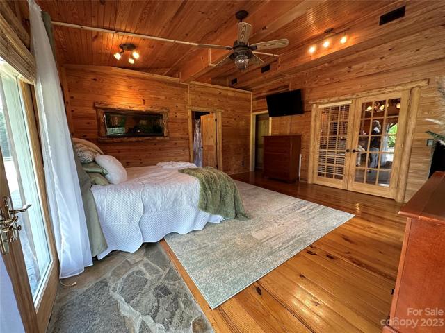Custom fish tank between bedroom and bathroom.