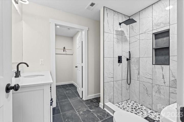 Enjoy singing in your stunning shower! Your large walk-in closet hosts plenty of space for clothing!
