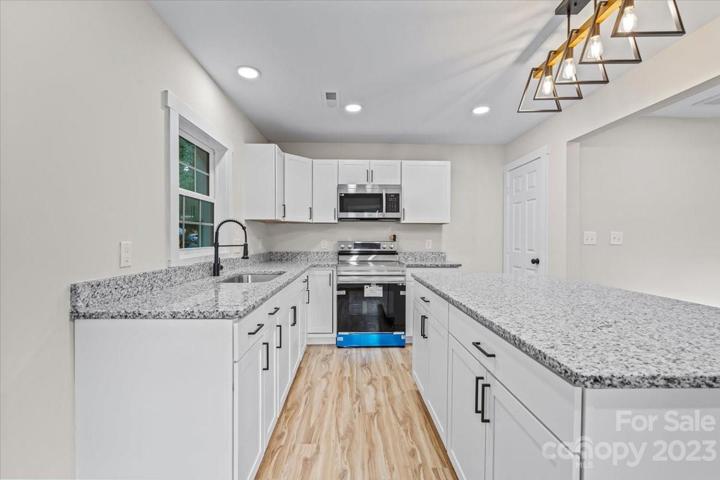 Ample cabinetry, countertop space and a walk-in pantry!