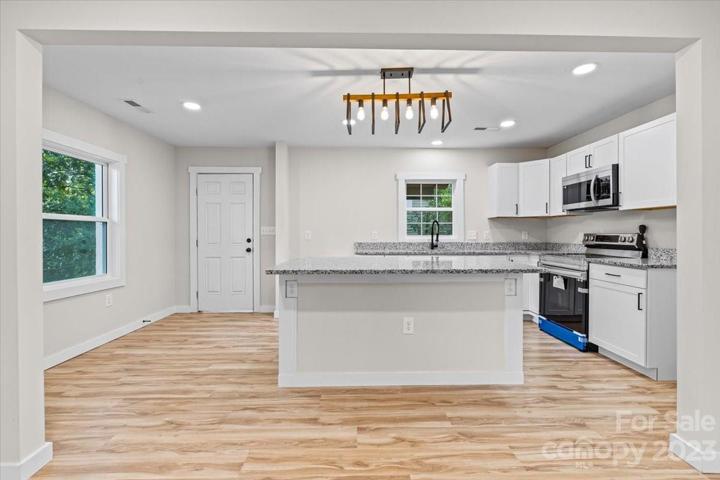 Welcome to your impeccably renovated open kitchen-living concept home in Shelby!