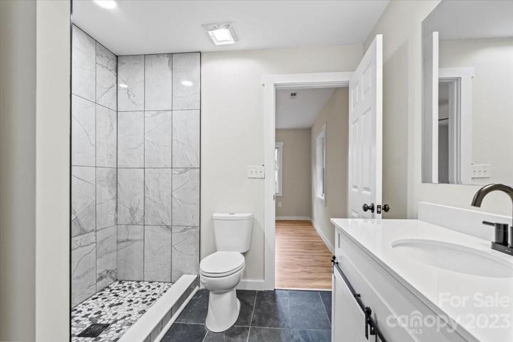 Immaculately tiled flooring and a retreat-like shower escape!