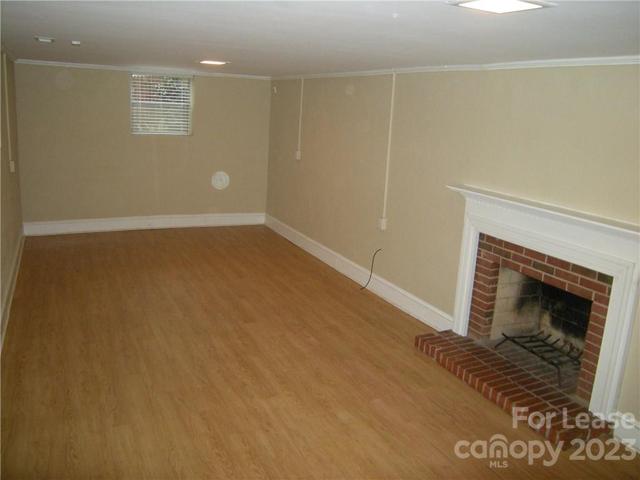 Downstairs Den with fireplace.