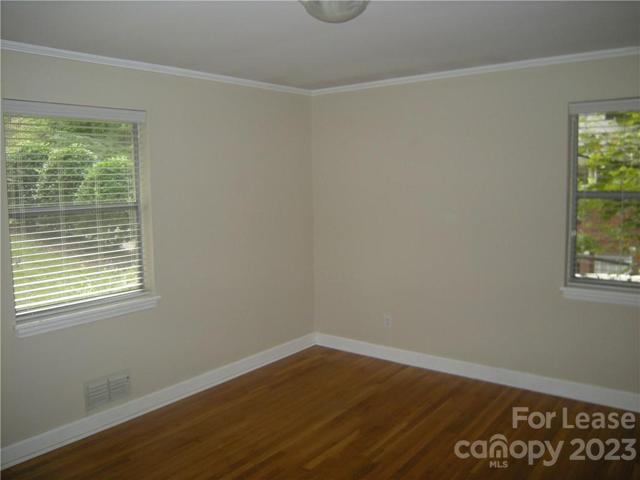 Large front, corner Bedroom.