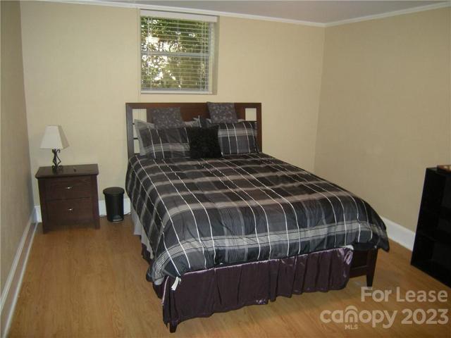 Downstairs bedroom with furniture.