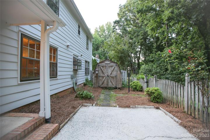 Patio area with shed