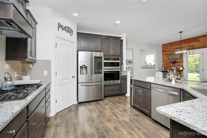Spacious pantry & plenty of cabinets.  All stainless steel appliances.