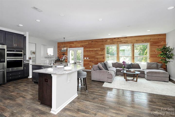 Pine accent wall & tree view outside windows.