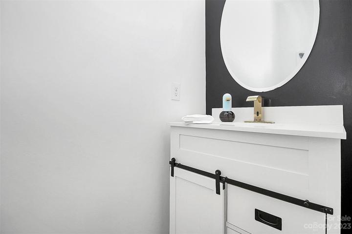 Powder room with touchless faucet.