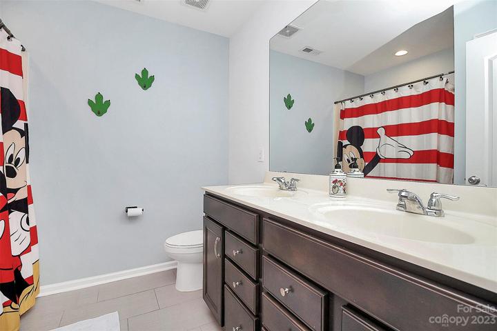 Guest bath, dual vanity with lots of storage.