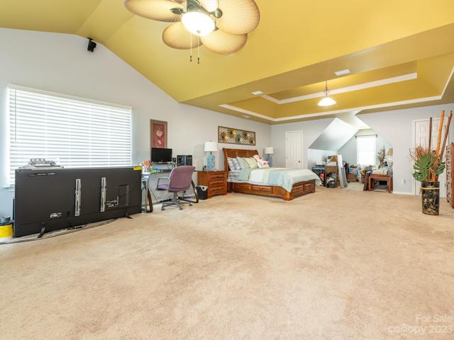 Primary Bedroom with private living area and fireplace