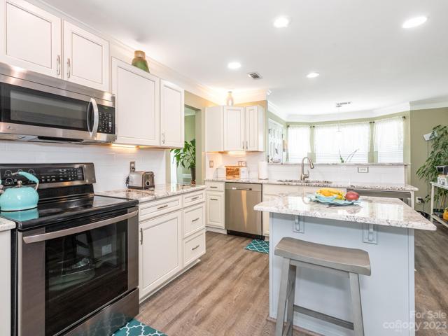 Kitchen with Bar Seating and Breakfast Nook