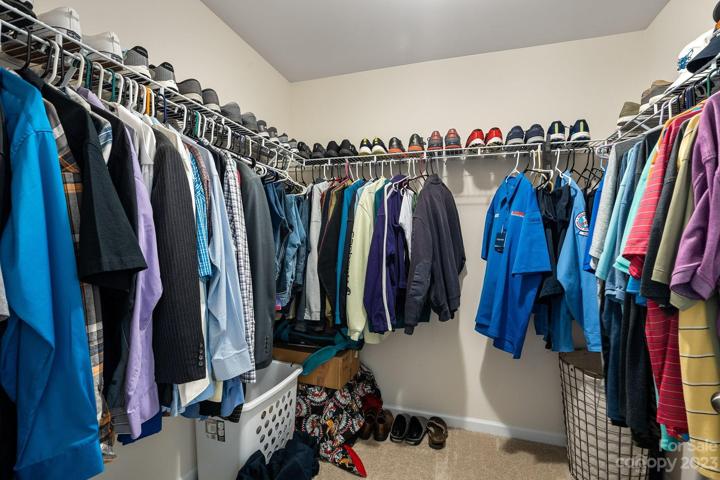 Primary walk-in closet.